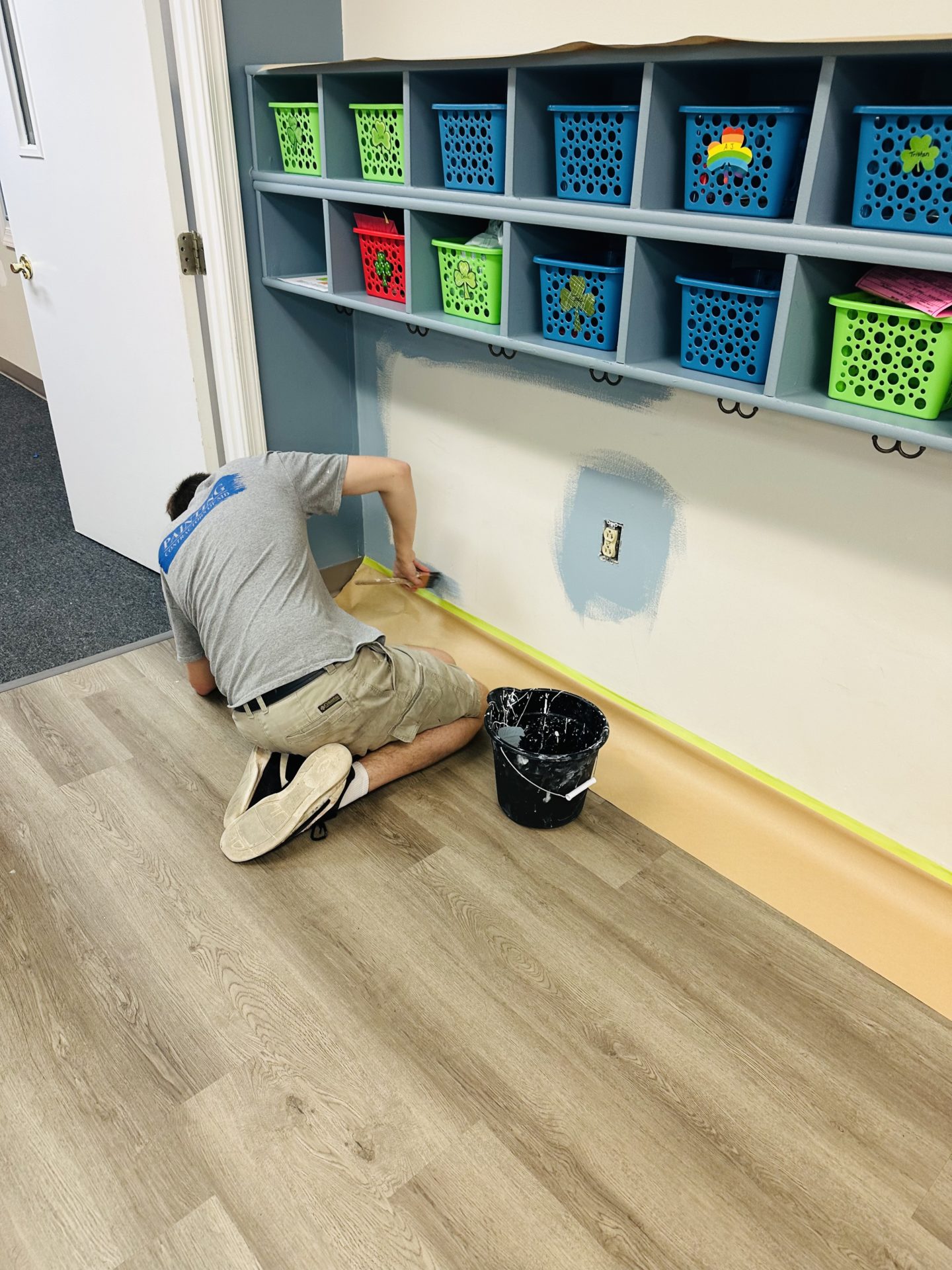 Professional painter ensuring a flawless and durable paint finish in daycare spaces