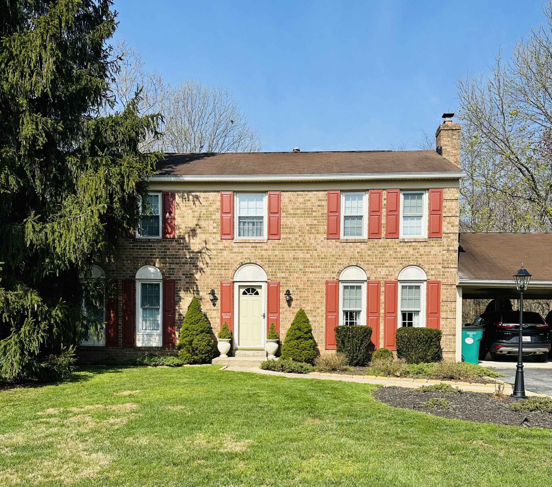 Image showcasing professionally painted vinyl shutters, elevating the aesthetic appeal of the house's facade