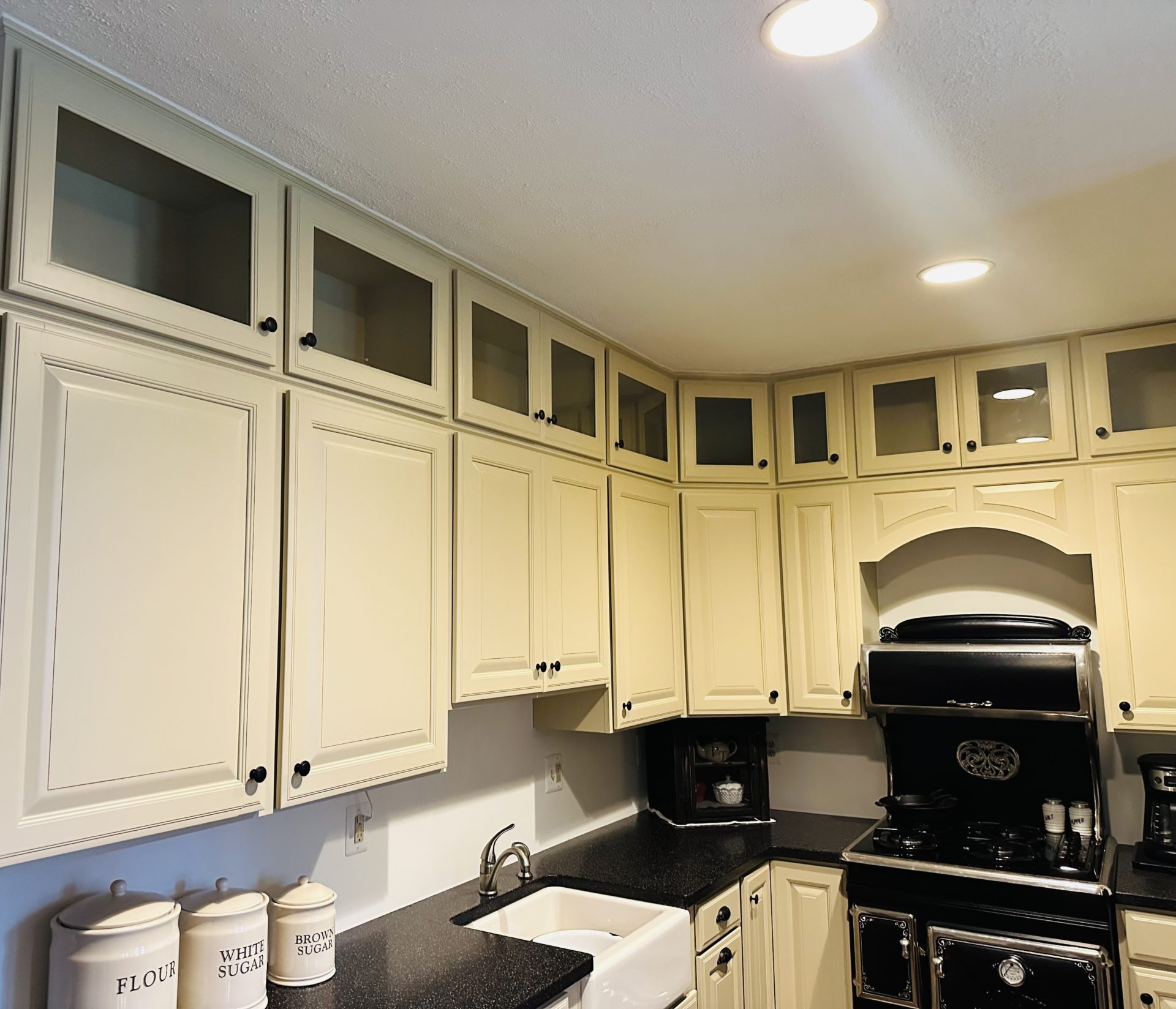 Freshly painted cabinets services results in kitchen space
