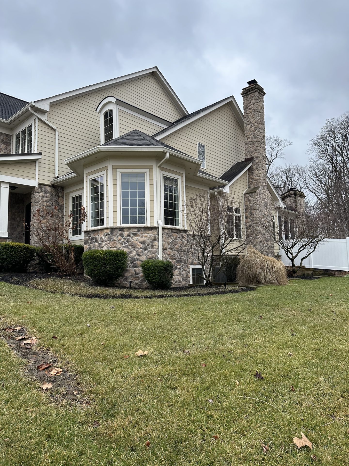 The outdated tan siding ready for a refreshing change.